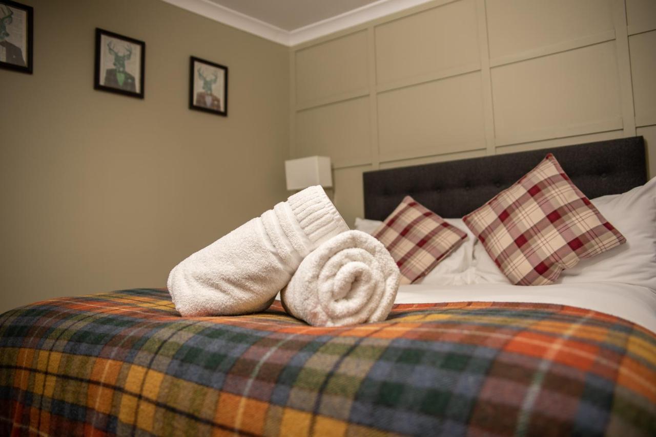 The Oak House Hotel Axbridge Exterior foto A bed with a duvet